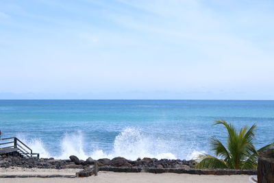 Action shot of splashing waves and blue sea water