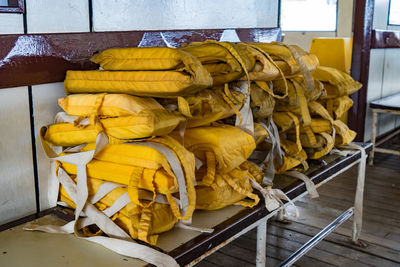 Yellow life jackets on table