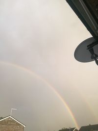 Low angle view of rainbow against sky