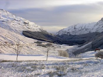 Scenic view of snowcapped mountains against sky