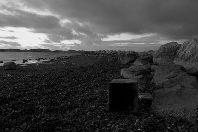 Scenic view of sea against cloudy sky