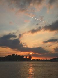 Scenic view of lake against sky during sunset