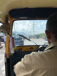 Rear view of man in car