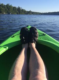 Low section of person in boat on sea