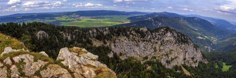 Panoramic view from the creux du van rocky cirque at sunrise, neuchatel canton, switzerland