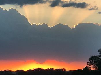 Scenic view of silhouette mountains against sky during sunset