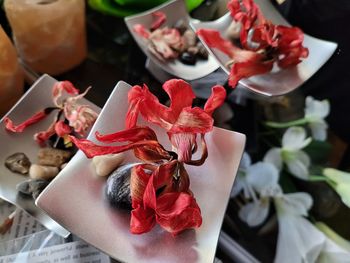 High angle view of rose petals on table