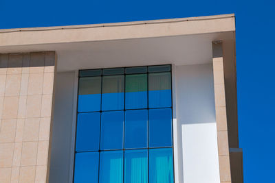 Low angle view of building against blue sky