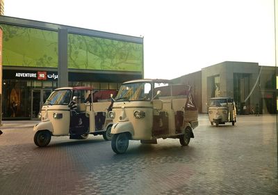 Vehicles on road along buildings