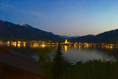 Scenic view of lake against sky at night