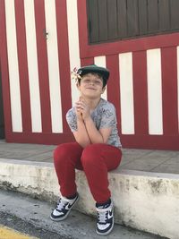 Low section of  a kid standing on steps in costa nova, aveiro