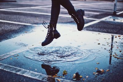 Low section of person on wet street