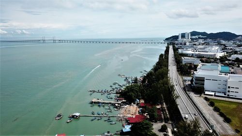 High angle view of road by sea against sky