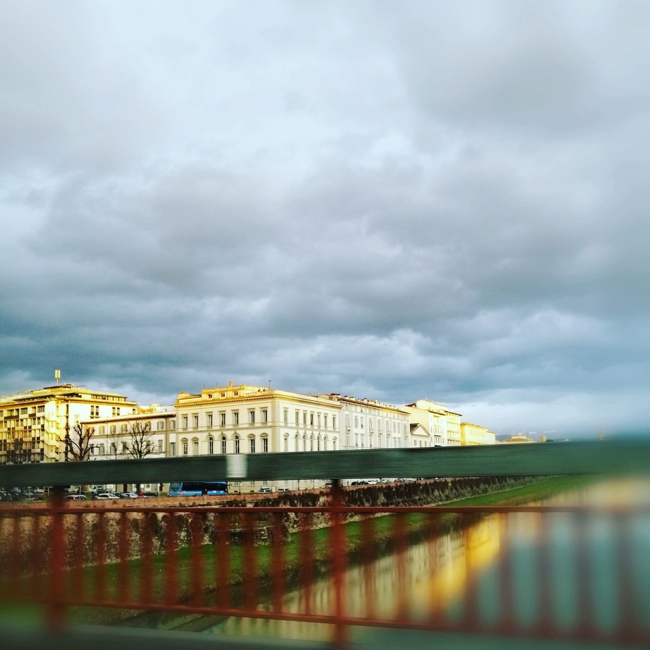 cloud, sky, architecture, built structure, water, reflection, nature, building exterior, no people, travel destinations, transportation, overcast, bridge, city, outdoors, travel, day, sea, building, cityscape, tourism