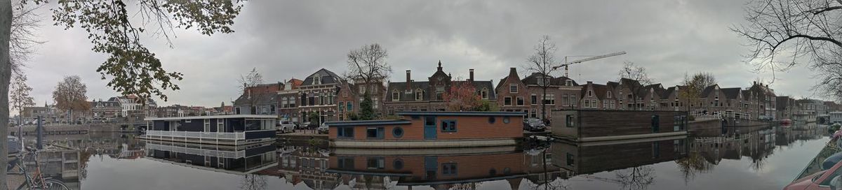 Panoramic view of buildings and city against sky