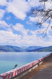 Scenic view of lake against cloudy sky