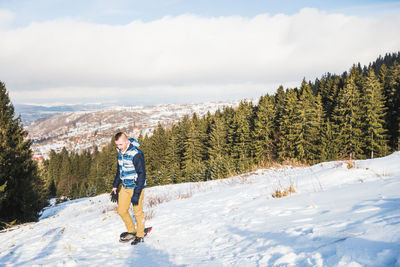 Full length of woman on mountain against sky