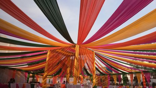 Close-up of multi colored umbrellas against clear sky
