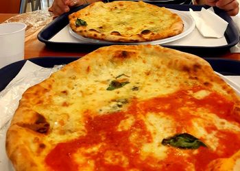 High angle view of pizza served on table