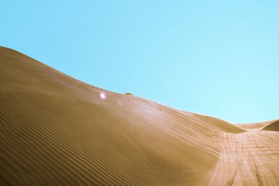 Scenic view of desert against clear sky