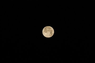 Low angle view of moon against sky at night