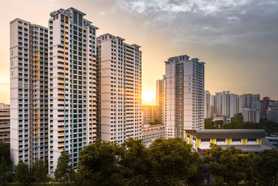 Modern buildings in city against sky