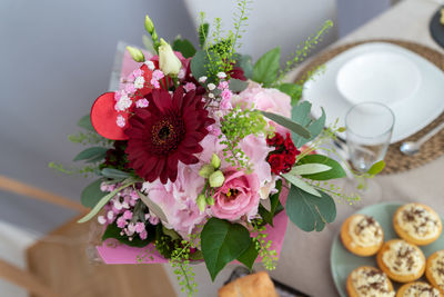 High angle view of pink roses on table