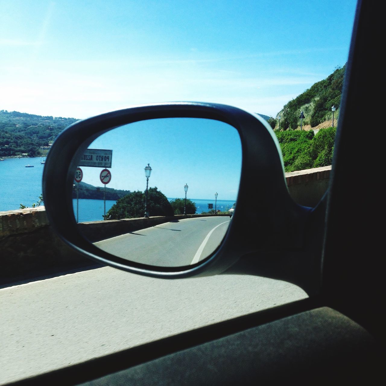 transportation, mode of transport, car, side-view mirror, land vehicle, reflection, sky, vehicle interior, water, glass - material, road, close-up, transparent, window, part of, cropped, day, sunlight, street, travel