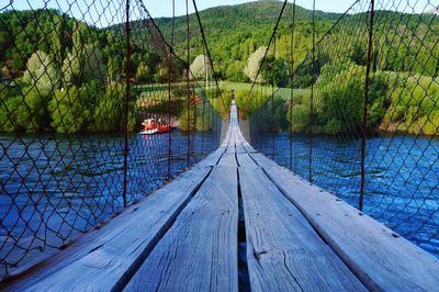 Pier over lake in forest