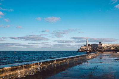 Scenic view of sea against blue sky