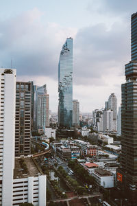 Modern buildings in city against sky