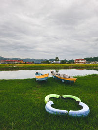 Fishing boats and wooden house on shore of perlis, malaysia.