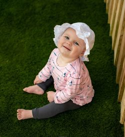 Portrait of cute girl smiling on field