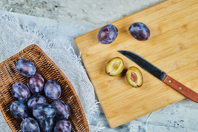 High angle view of fruits on cutting board