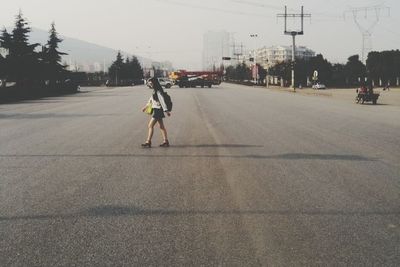 Woman walking on city street