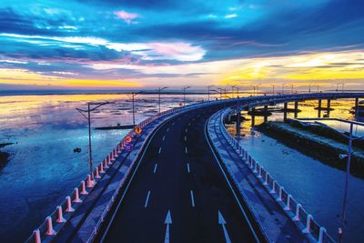 View of bridge over sea against sky during sunset