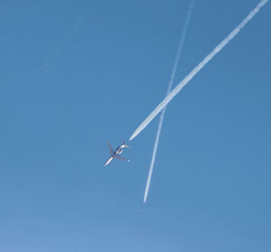 Low angle view of airplane flying in sky