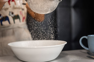 Close-up of tea cup in bowl on table