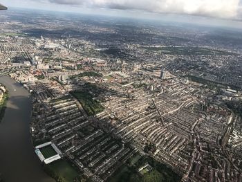 High angle view of buildings in city against sky