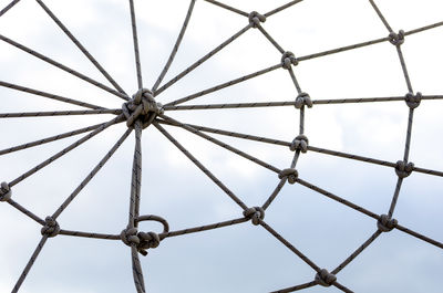 Low angle view of metallic structure against sky