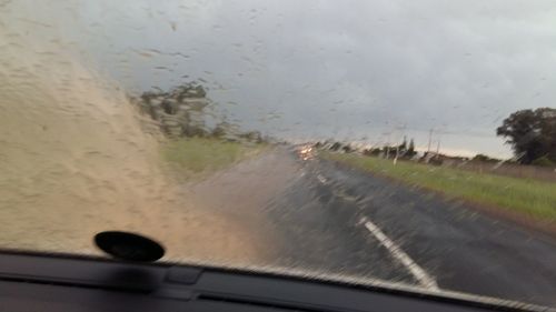 Road seen through car windshield