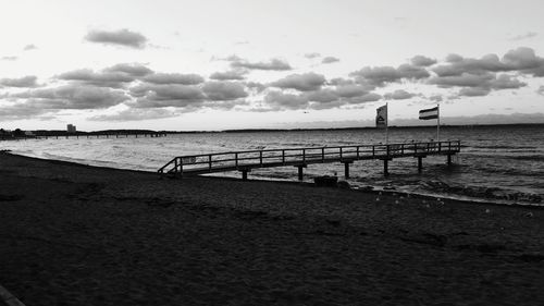 Scenic view of sea against cloudy sky