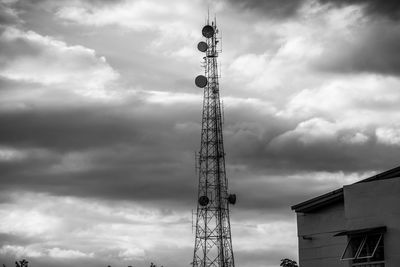 Low angle view of communications tower against sky