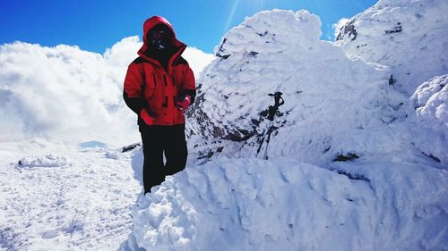 People standing on snow covered mountain