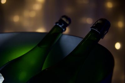 Close-up of wine bottles on glass