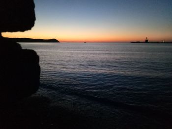 Scenic view of sea against clear sky during sunset