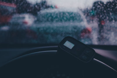 Close-up of raindrops on car windshield