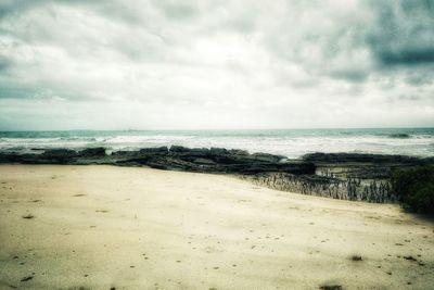 Scenic view of beach against sky