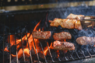 Close-up of meat on barbecue grill