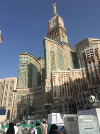 Low angle view of buildings in city against sky 